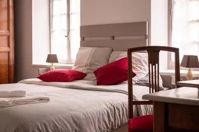 Un ou plusieurs lits dans un hébergement de l'établissement Une Suite au jardin