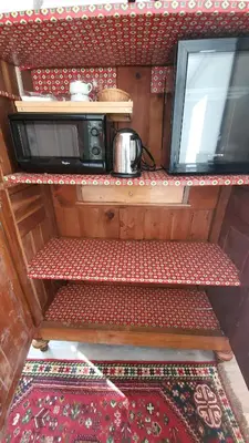 Cuisine ou kitchenette dans l'établissement Une Suite au jardin
