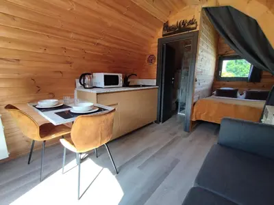 Cuisine ou kitchenette dans l'établissement Cottage climatisé avec terrasse privative et kitchenette