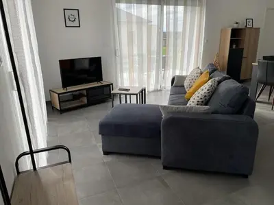Télévision ou salle de divertissement dans l'établissement Maison de vacances