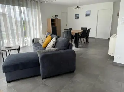 Coin salon dans l'établissement Maison de vacances