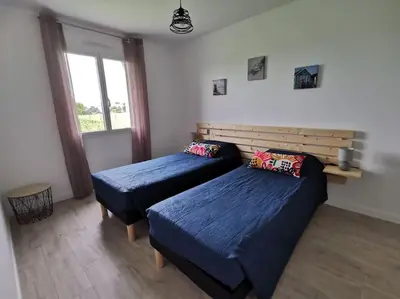 Un ou plusieurs lits dans un hébergement de l'établissement Maison de vacances