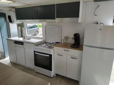 Cuisine ou kitchenette dans l'établissement Gite 