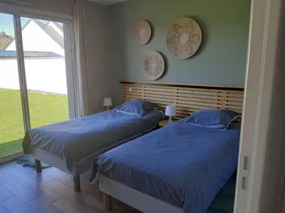 Un ou plusieurs lits dans un hébergement de l'établissement Villa Jacuzzi au pied de la Baie du Mont St Michel