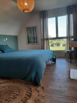 Un ou plusieurs lits dans un hébergement de l'établissement Villa Jacuzzi au pied de la Baie du Mont St Michel