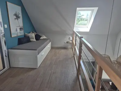 Coin salon dans l'établissement Villa Jacuzzi au pied de la Baie du Mont St Michel