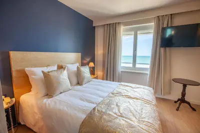 Un ou plusieurs lits dans un hébergement de l'établissement Hôtel des Isles
