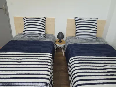 Un ou plusieurs lits dans un hébergement de l'établissement Gîte entre terre et baie