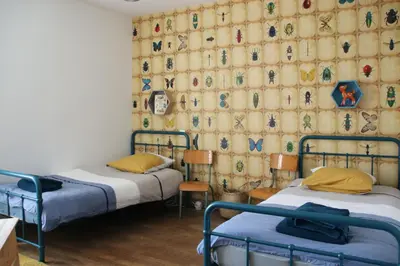 Un ou plusieurs lits dans un hébergement de l'établissement Le Vieil Home, au pied de la cité médiévale