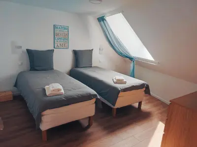 Un ou plusieurs lits dans un hébergement de l'établissement Barneville Plage appart cosy avec terrasse 150m de la mer