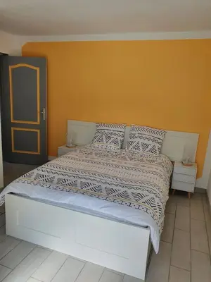 Un ou plusieurs lits dans un hébergement de l'établissement Gîte du ronthaunay