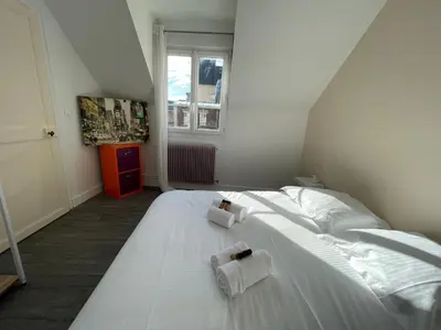 Un ou plusieurs lits dans un hébergement de l'établissement Charmante maison front de mer et centre ville