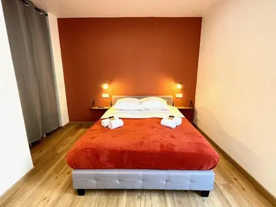 Un ou plusieurs lits dans un hébergement de l'établissement Studio avec grande terrasse et parking privatifs