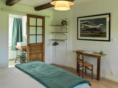 Un ou plusieurs lits dans un hébergement de l'établissement Le Manoir de la Beslière - Gîte et Chambres d'hôtes
