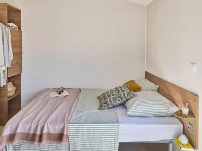Un ou plusieurs lits dans un hébergement de l'établissement Camping le Rivage