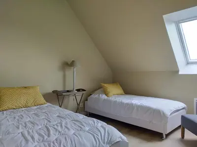 Un ou plusieurs lits dans un hébergement de l'établissement ESCAPADE EN BAIE 3étoiles