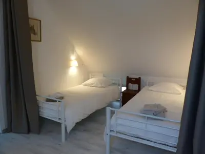 Un ou plusieurs lits dans un hébergement de l'établissement Cottage des Mézières