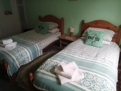Un ou plusieurs lits dans un hébergement de l'établissement Lenard Charles Bed & Breakfast