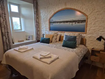 Un ou plusieurs lits dans un hébergement de l'établissement La Fiere Bridge Guest House