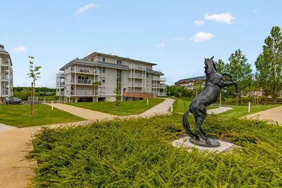 Jardin de l'établissement Superbe appartement neuf avec un grand balcon - Cabourg - Welkeys