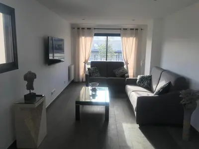Coin salon dans l'établissement Aux Grès des Vagues