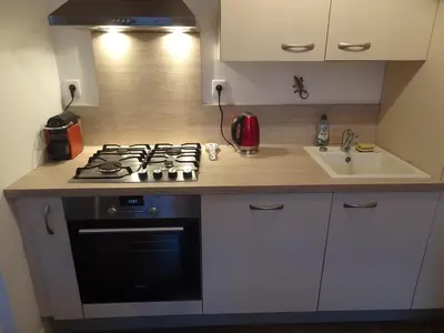 Cuisine ou kitchenette dans l'établissement Appartement calme en plein centre ville