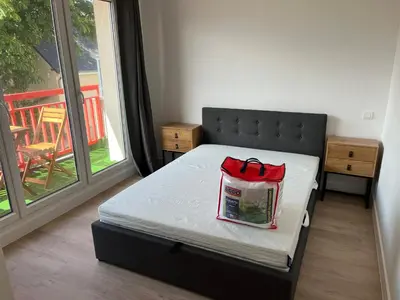 Un ou plusieurs lits dans un hébergement de l'établissement Appartement tout confort