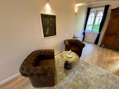 Coin salon dans l'établissement Le Clos de la Chapelle Bayeux