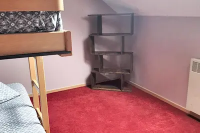 Un ou plusieurs lits dans un hébergement de l'établissement Maison chaleureuse à Saint-Remy avec jardin enchanteur