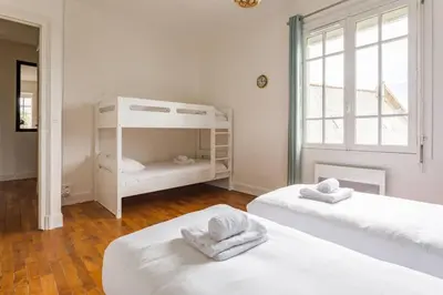 Un ou plusieurs lits dans un hébergement de l'établissement Saint-Exupéry - Bel appartement rénové - Parking