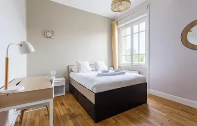 Un ou plusieurs lits dans un hébergement de l'établissement Saint-Exupéry - Bel appartement rénové - Parking