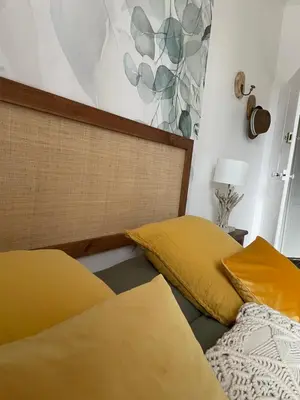 Un ou plusieurs lits dans un hébergement de l'établissement Les Hirondelles de la villa des roses