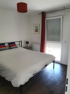 Un ou plusieurs lits dans un hébergement de l'établissement Othello Sea Flat - Appartement terasse familial
