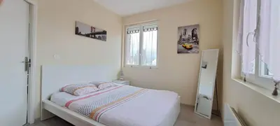 Un ou plusieurs lits dans un hébergement de l'établissement Appartement 3 étoiles de 63m2
