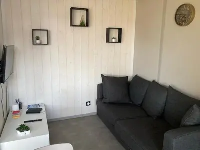 Coin salon dans l'établissement COTTAGE 4/5 pers