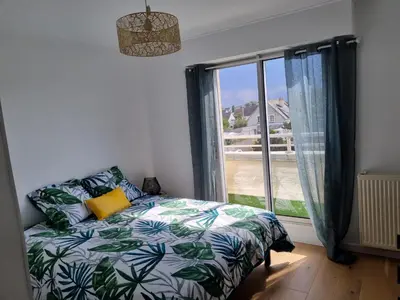 Un ou plusieurs lits dans un hébergement de l'établissement Lion Beach