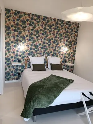 Un ou plusieurs lits dans un hébergement de l'établissement Maison Bailly