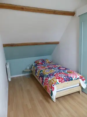 Un ou plusieurs lits dans un hébergement de l'établissement Jolie maison pour 4 à 6 personnes