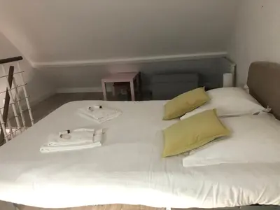 Un ou plusieurs lits dans un hébergement de l'établissement Maison calme avec terrasse - Calypso