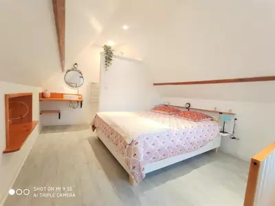 Un ou plusieurs lits dans un hébergement de l'établissement Gîte Les Hirondelles - Bord de mer et campagne