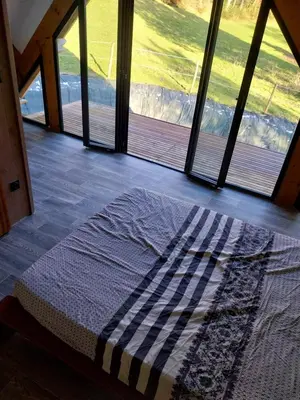 Un ou plusieurs lits dans un hébergement de l'établissement Gîte en lisière de forêt andaine