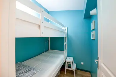 Un ou plusieurs lits dans un hébergement de l'établissement Aux Bains des Mots - vue mer