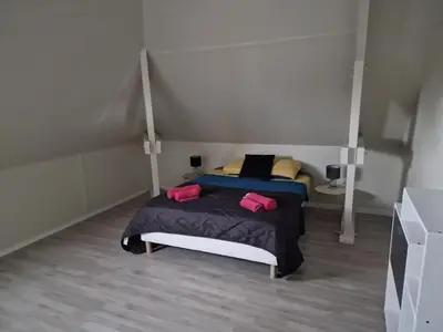 Un ou plusieurs lits dans un hébergement de l'établissement Villa Boubou 10 chambre