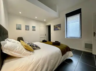 Un ou plusieurs lits dans un hébergement de l'établissement Le logis BAYA - WEEKEND & HOLIDAY - WIFI & TV