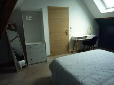 Un ou plusieurs lits dans un hébergement de l'établissement Maison rénovée dans le bocage Normand avec jacuzzi