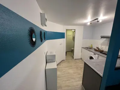 Cuisine ou kitchenette dans l'établissement La Pause - studio en ville