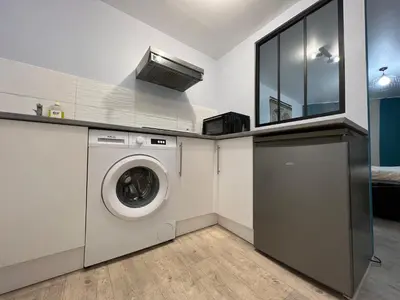 Cuisine ou kitchenette dans l'établissement La Pause - studio en ville