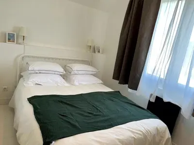 Un ou plusieurs lits dans un hébergement de l'établissement LA CABINE VUE MER
