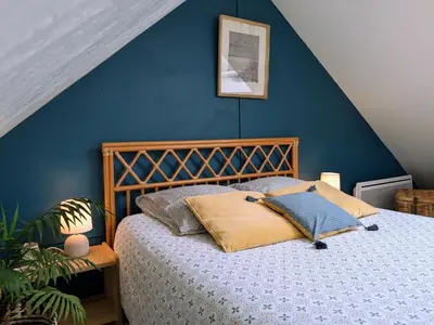 Un ou plusieurs lits dans un hébergement de l'établissement La petite enseigne - Chez Hélène - Gîtes en baie