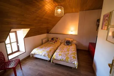 Un ou plusieurs lits dans un hébergement de l'établissement Gîte de charme avec Spa, baie du Mont St Michel